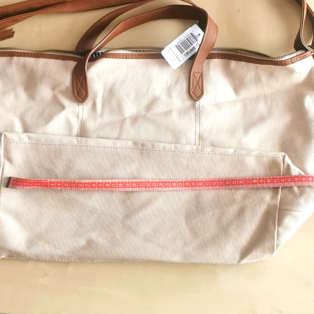 NWT canvas duffle bag.